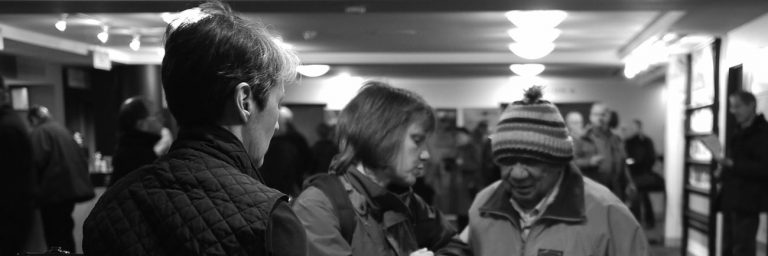 photo: patrons pick up equipment in the Vancouver Playhouse lobby (Rick Waines)