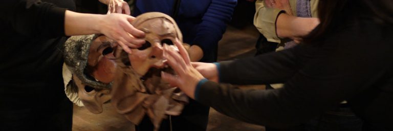 photo: hands touching masks at the Don Quixote Touch Tour (Rick Waines)
